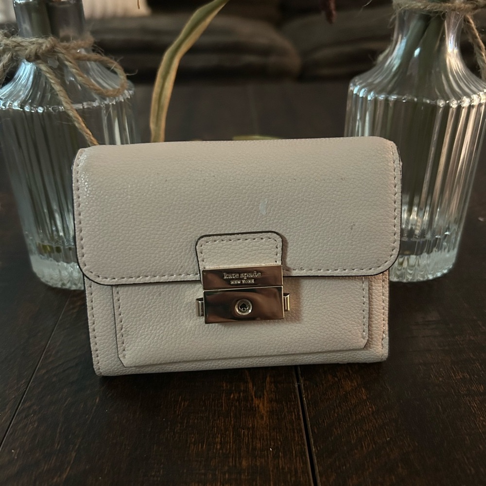 Kate Spade Cream Structured Voyage small bifold wallet